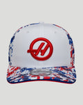 White New Era Haas Team 9Seventy cap with red circular logo and blue and red paint splatter on the brim