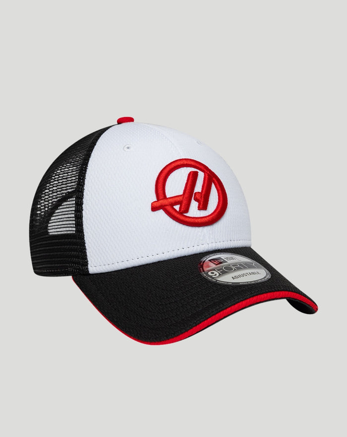 Side angle of the Haas cap showing white crown and black mesh back with red Haas logo on the front