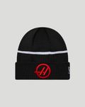 Black knit cuff beanie with a white stripe and red Haas emblem on the folded cuff