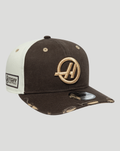 Three quarter view of a brown and cream Haas Team 9Seventy cap showing the embroidered logo on the front and a TGR patch on the side.