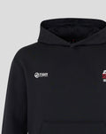 Black Haas F1 World Tour hoodie with drawstring hood, front kangaroo pocket, white TGR Haas Team logo on left chest and a graphic on the opposite chest.