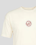 Small circular red Haas F1 Team roundel with blue stars on left chest of white T shirt.