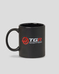 Side view of black Haas Team Mug with curved handle and red TGR Haas F1 Team logo