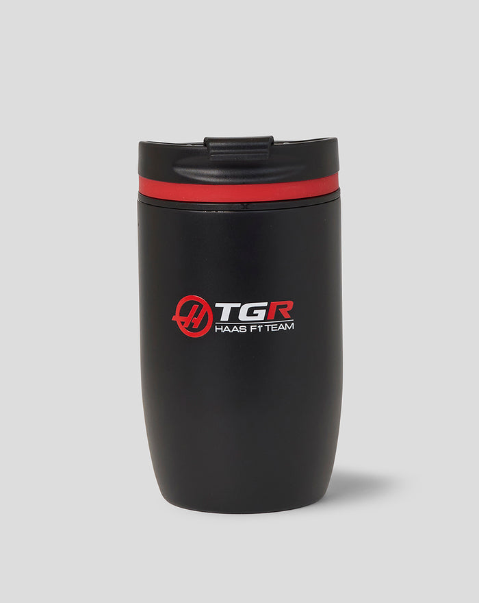 Black Haas F1 Team travel coffee cup with red accent ring and center logos