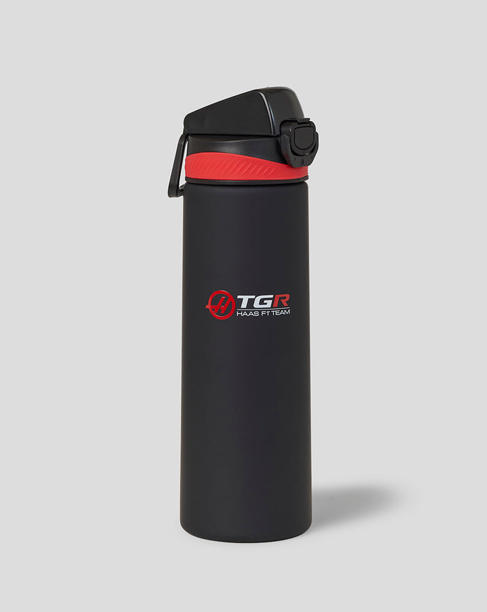 Black 750ml water bottle with red cap and Haas F1 Team logo.