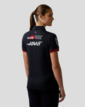 Back view of Haas Team Women's Short Sleeve Polo Shirt featuring large sponsor logos and Haas branding on navy fabric with red accents