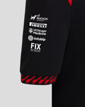 Black Haas Team polo sleeve with stacked sponsor logos Ruckus Networks Pirelli UChicago Medicine Infobip and FIX Network and red cuff edge.