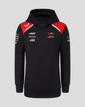 Model wearing Official Haas Team Junior Pullover Hoodie in black with red accents and branding