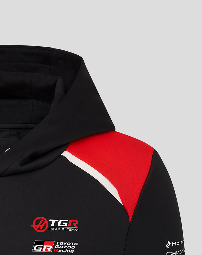 Haas Team Junior Pullover Hoodie close-up showing black fabric red shoulder panel and front branding