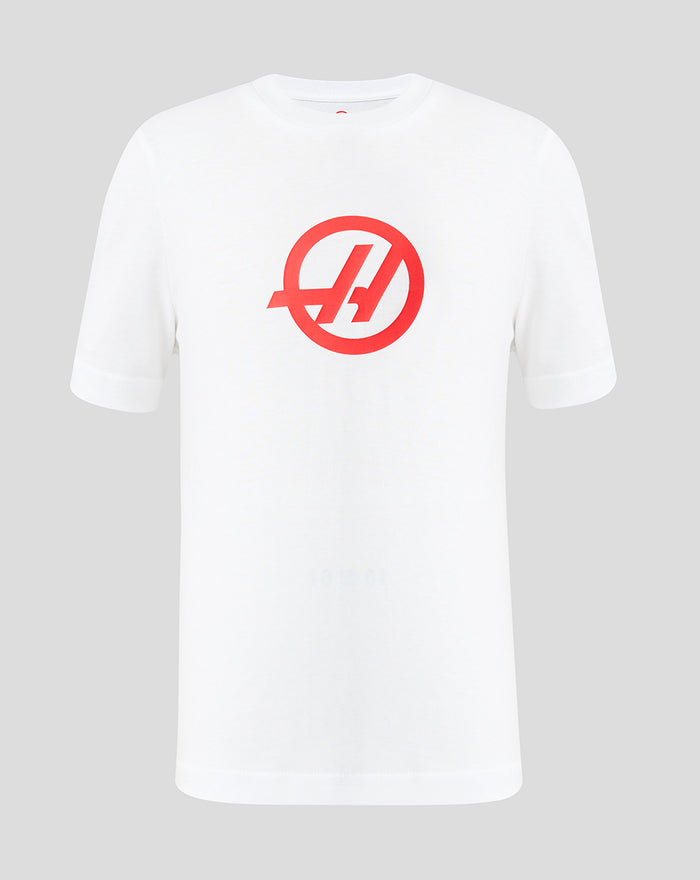 Front view of bright white Haas Team Junior Regular Fit T-Shirt with bold Haas branding on the chest.