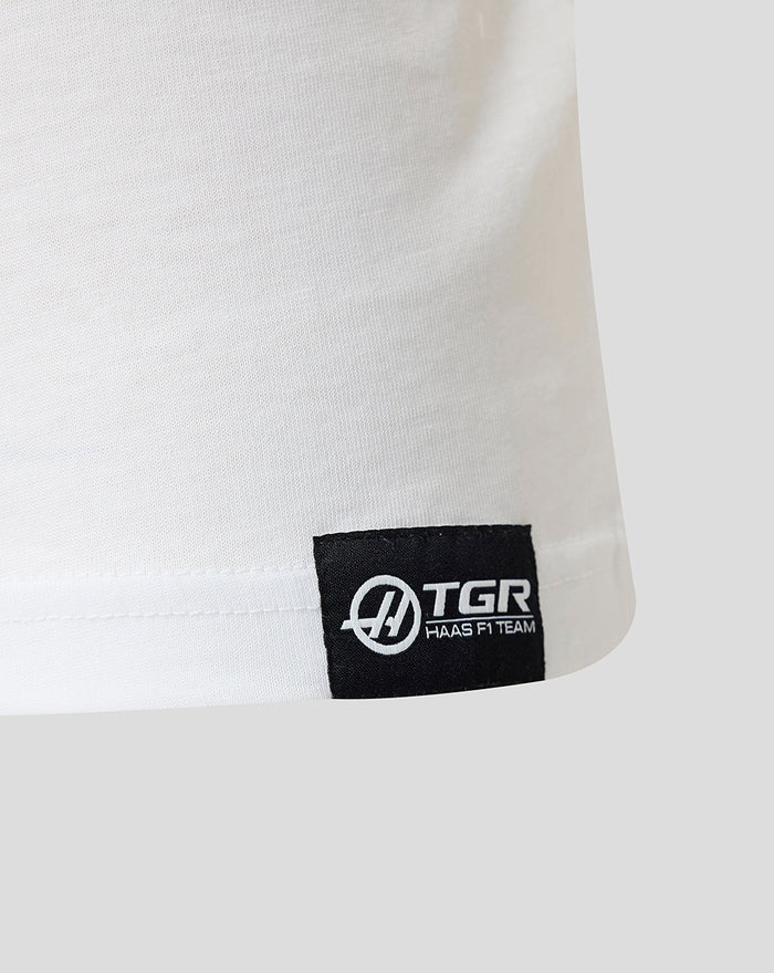 Haas F1 Team woven label at the lower front hem of a white T-shirt