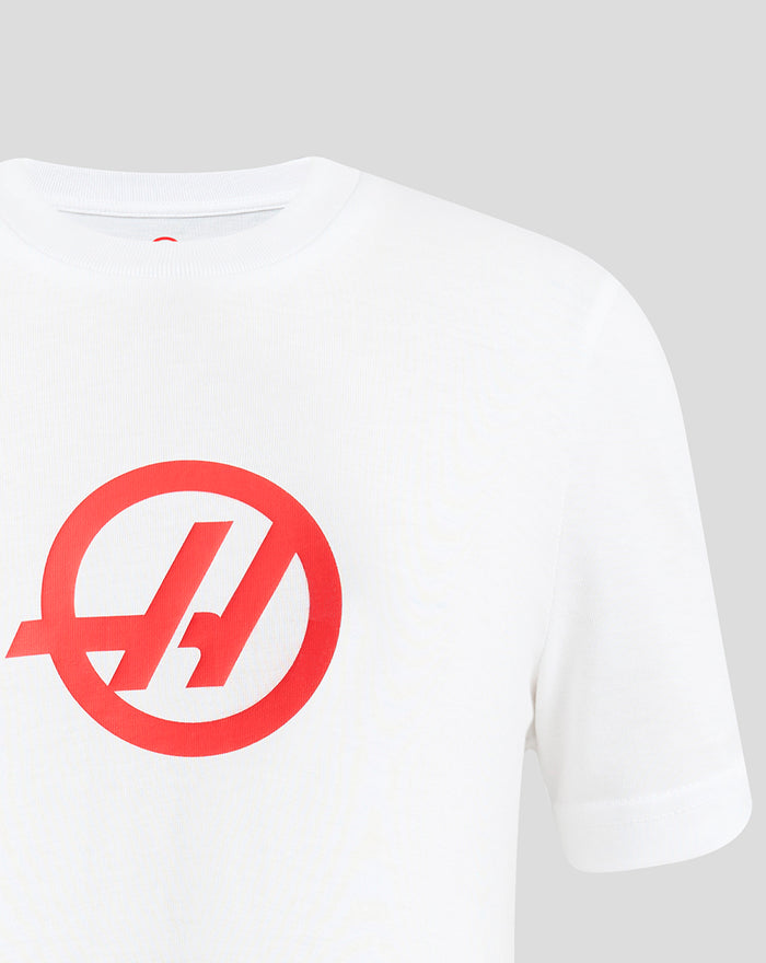Front view of white Haas Team Junior Regular Fit T-Shirt with a large red logo on the chest