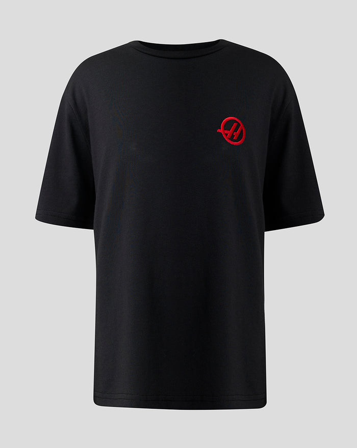 Front view of black Haas Team Junior Monogram T Shirt with a red circular H logo on the left chest.