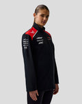 Black Haas Team Soft Shell Jacket with red shoulder panels and full front zipper worn by a model