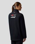 Back view highlighting bold Haas branding across the back of the jacket and subtle sponsor logos on the sleeve