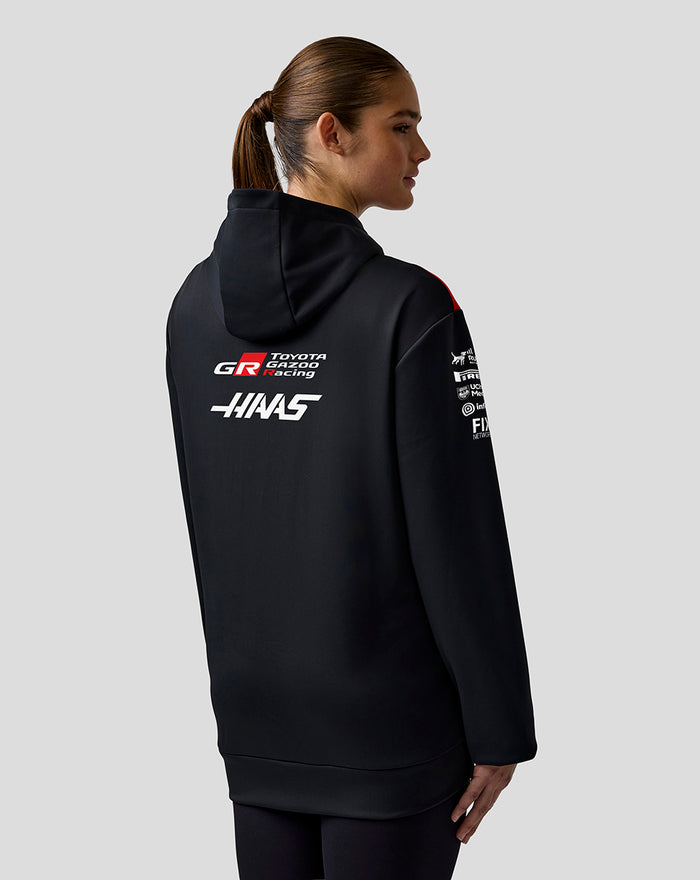 Back view of black Haas Team pullover hoodie with white Haas branding on the back.