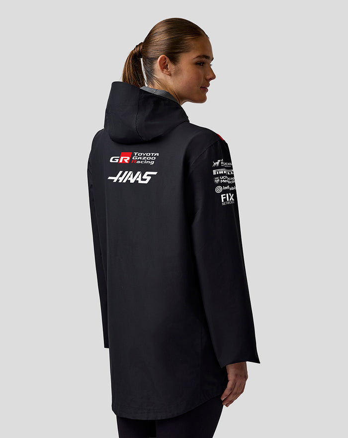 Back view of a black Haas Team water-resistant jacket with sponsor logos on the back.