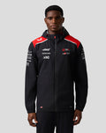 Front view of Haas Team water resistant jacket on a model, black with red shoulder panels, hood and full front zip.