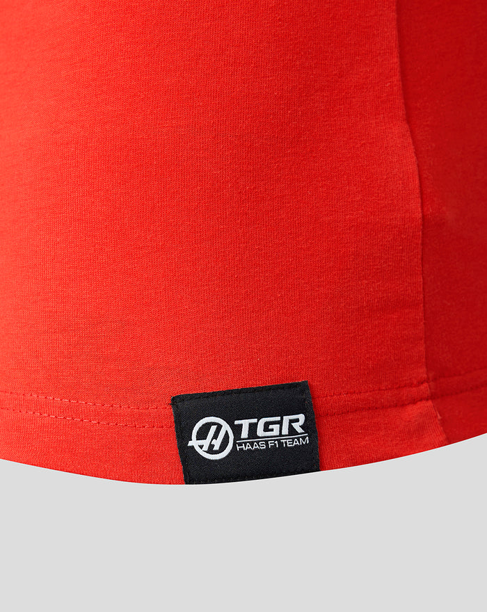 Red Haas Team T-Shirt close-up of the hem with a black woven sponsor label at the lower front