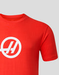 Shoulder and sleeve area of the red Haas Team T-Shirt with a large white logo on the chest