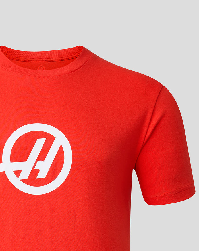 Shoulder and sleeve area of the red Haas Team T-Shirt with a large white logo on the chest
