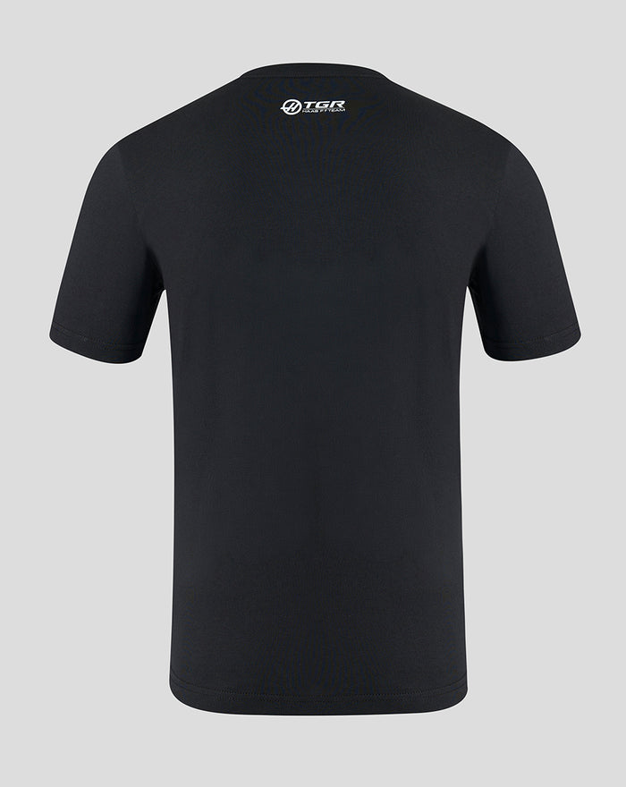 Back view of a black Haas Team T shirt with a white TGR Haas logo at the upper back