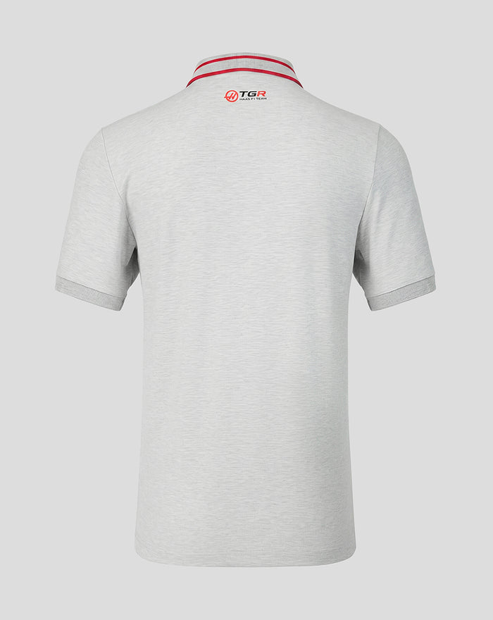 Back view of light gray Haas Team polo with red striped collar and TGR Haas F1 Team logo at the neck.