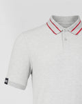 Close up of light grey Haas polo showing a ribbed collar with red stripes and a sleeve label