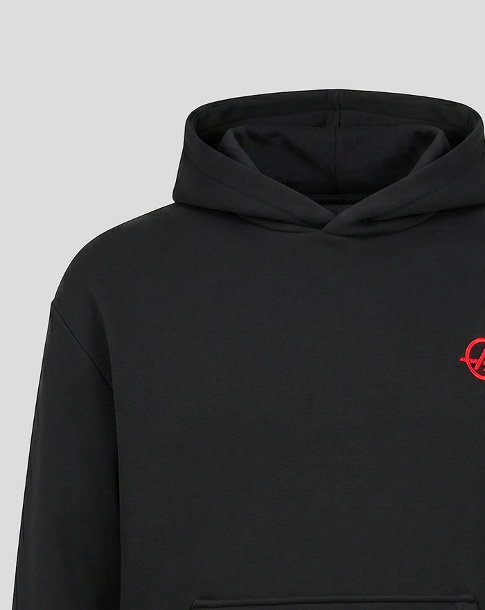 Close-up of black Haas hoodie with red embroidered emblem on the left chest.