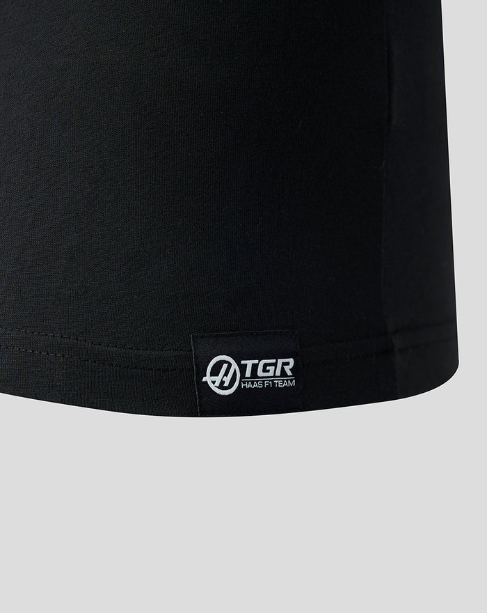 Woven label at the lower left front hem with TGR Haas F1 Team branding