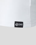 Black woven label with sponsor branding at the lower left front hem on a white T shirt
