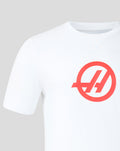 Front of white T shirt featuring a large red circular Haas logo on the chest